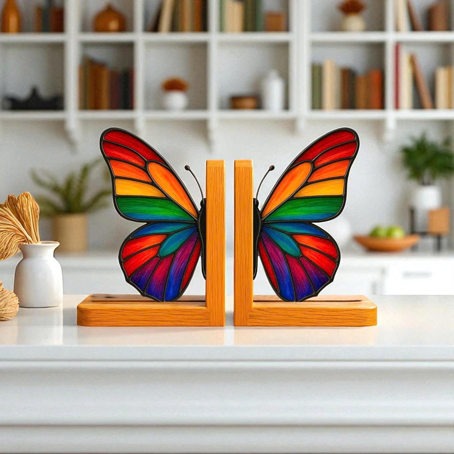 Handmade stained glass butterfly bookends with oak wood base, unique orange monarch wing design, decorative bookshelf decor and gift for book lovers.