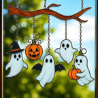 Handmade stained glass suncatcher with two pumpkins and ghost for Halloween home décor.