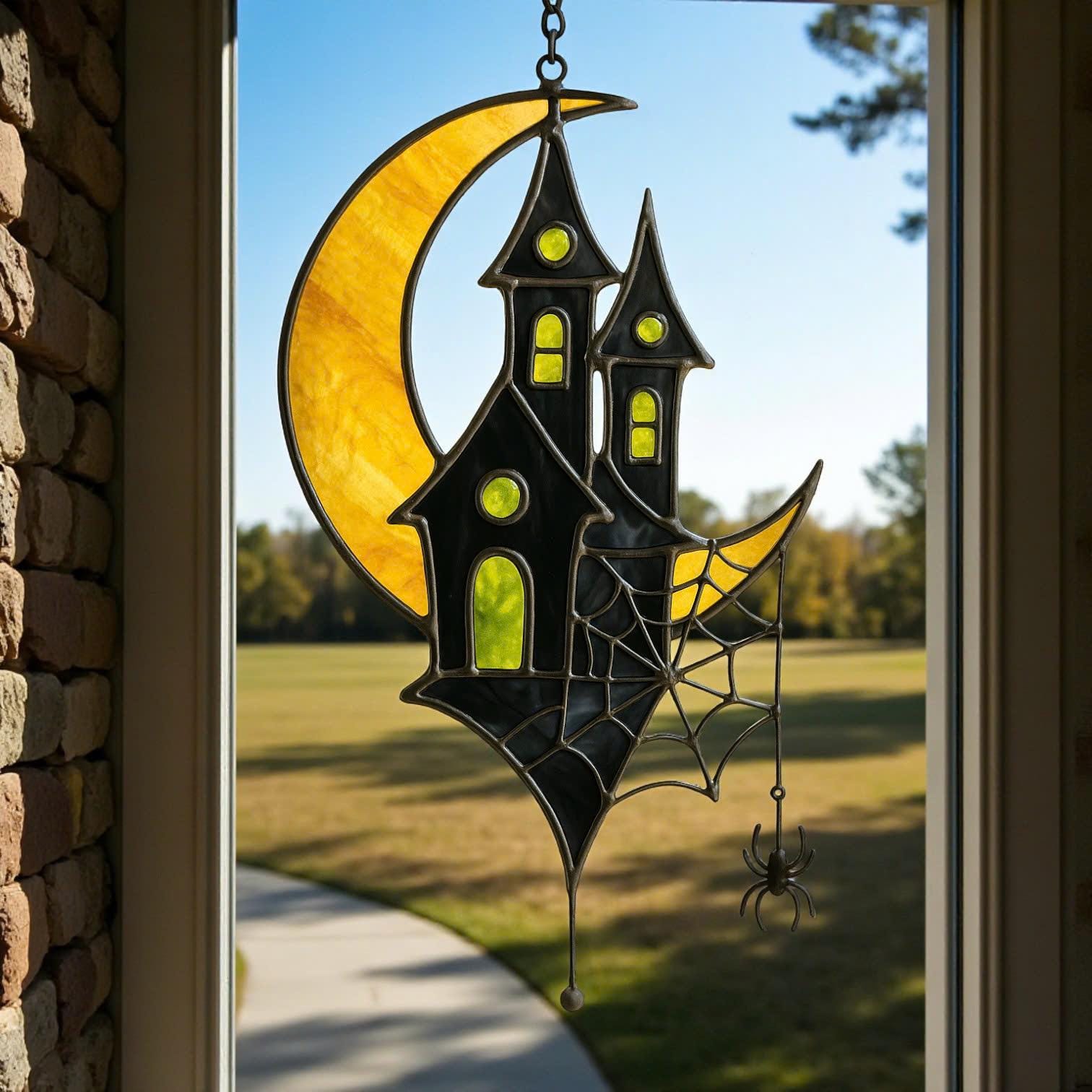 Handmade stained glass moon and haunted house Halloween window decoration