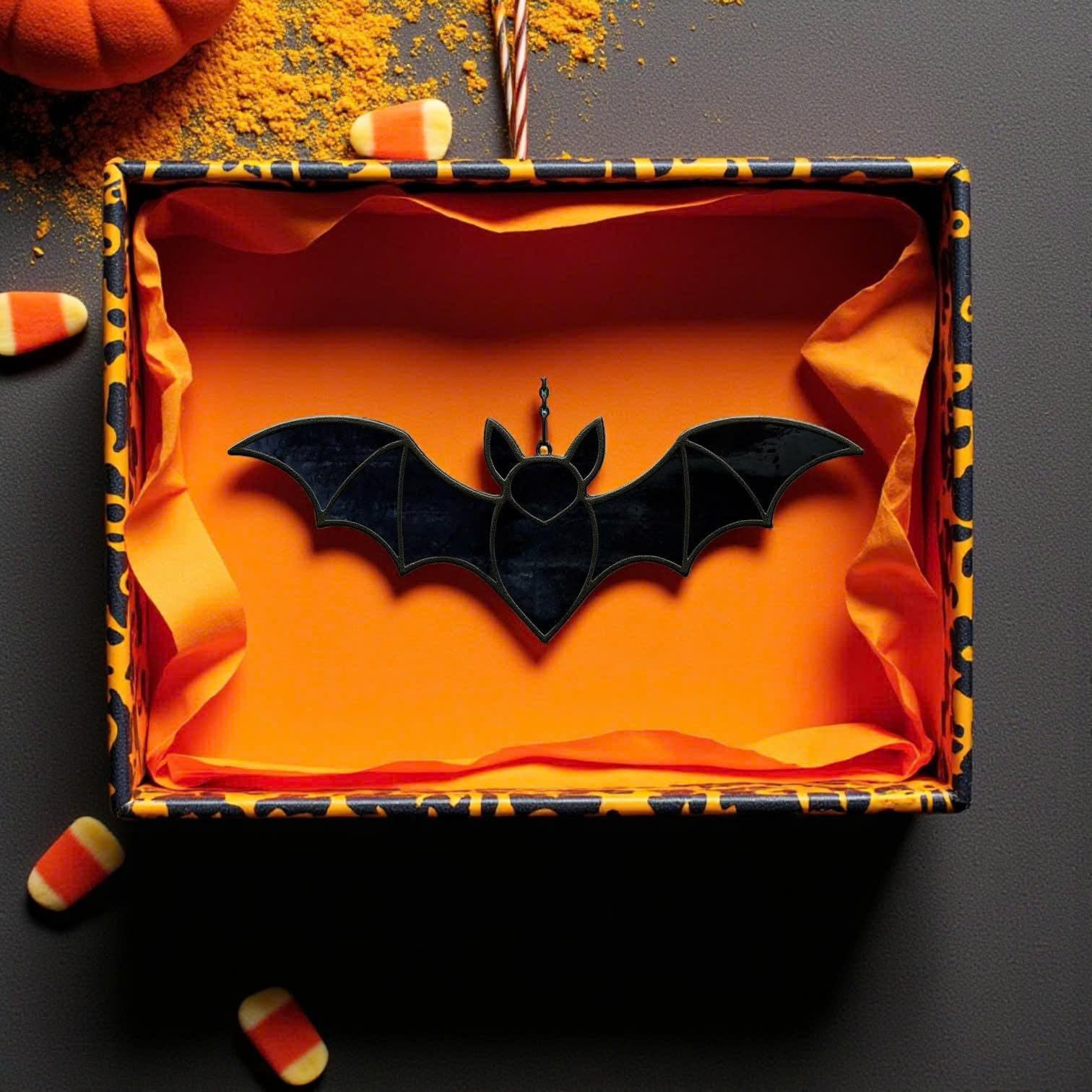 Stained glass bat suncatcher in festive orange Halloween gift box, ready for seasonal gift giving.