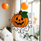 Handmade stained glass pumpkin Halloween ornament with swirl decoration