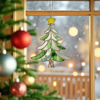 Stained glass Christmas tree suncatcher (Style #3) hanging next to a decorated real Christmas tree.