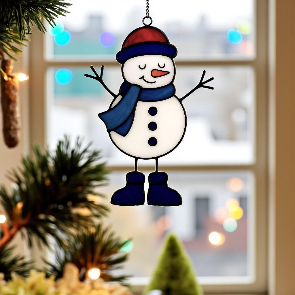 Stained glass snowman (Style #1, blue hat) hanging against a bright blue sky, showing the glass translucency and wispy colors.