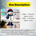 Snowman ornament (Style #4, blue hat, blue scarf) hanging in a window with blinds, showing indoor holiday decor.