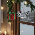 Stained glass raccoon and snowman ornaments displayed on window, festive winter decor.