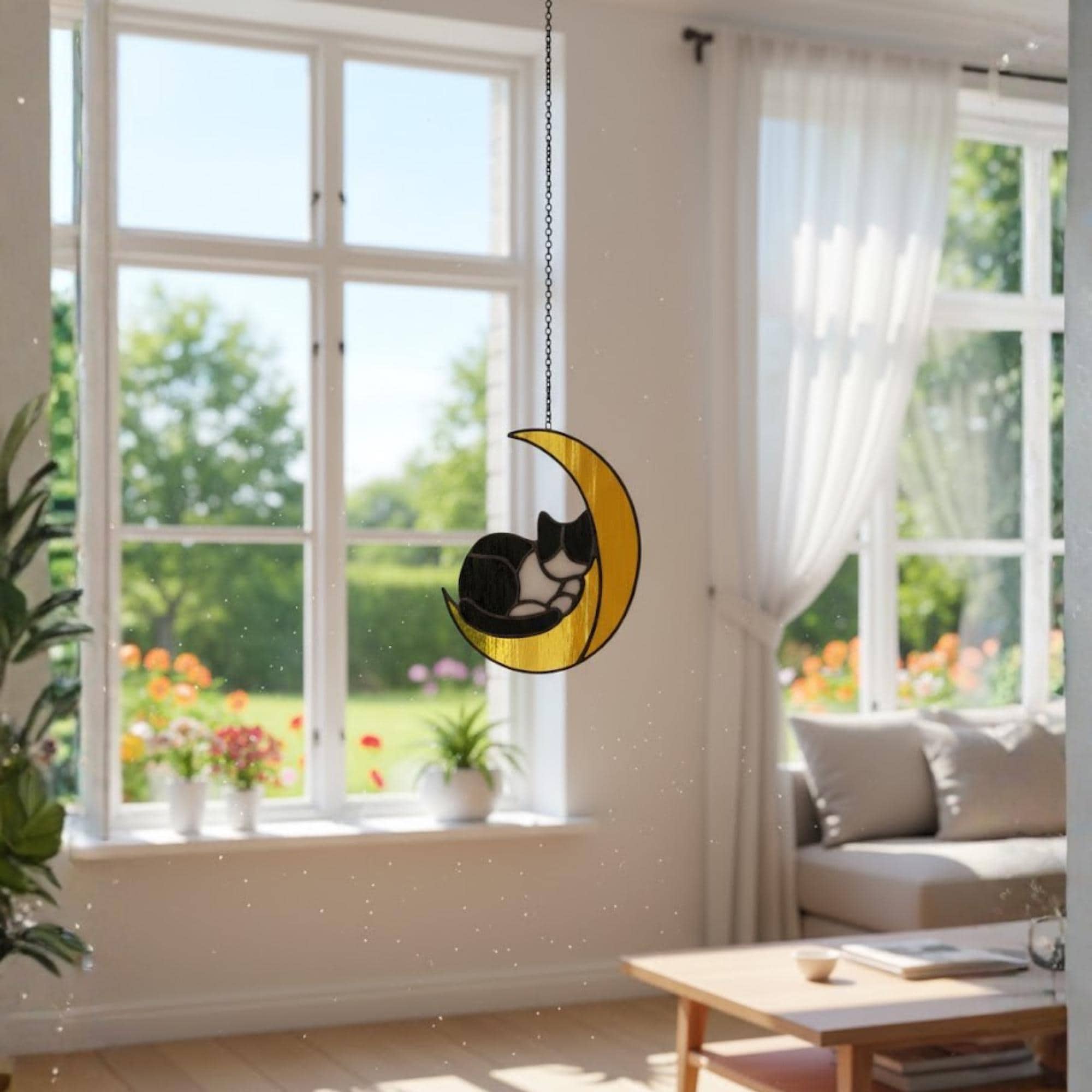 Couple exchanging handmade cat on the moon stained glass suncatcher, perfect gift for cat lovers