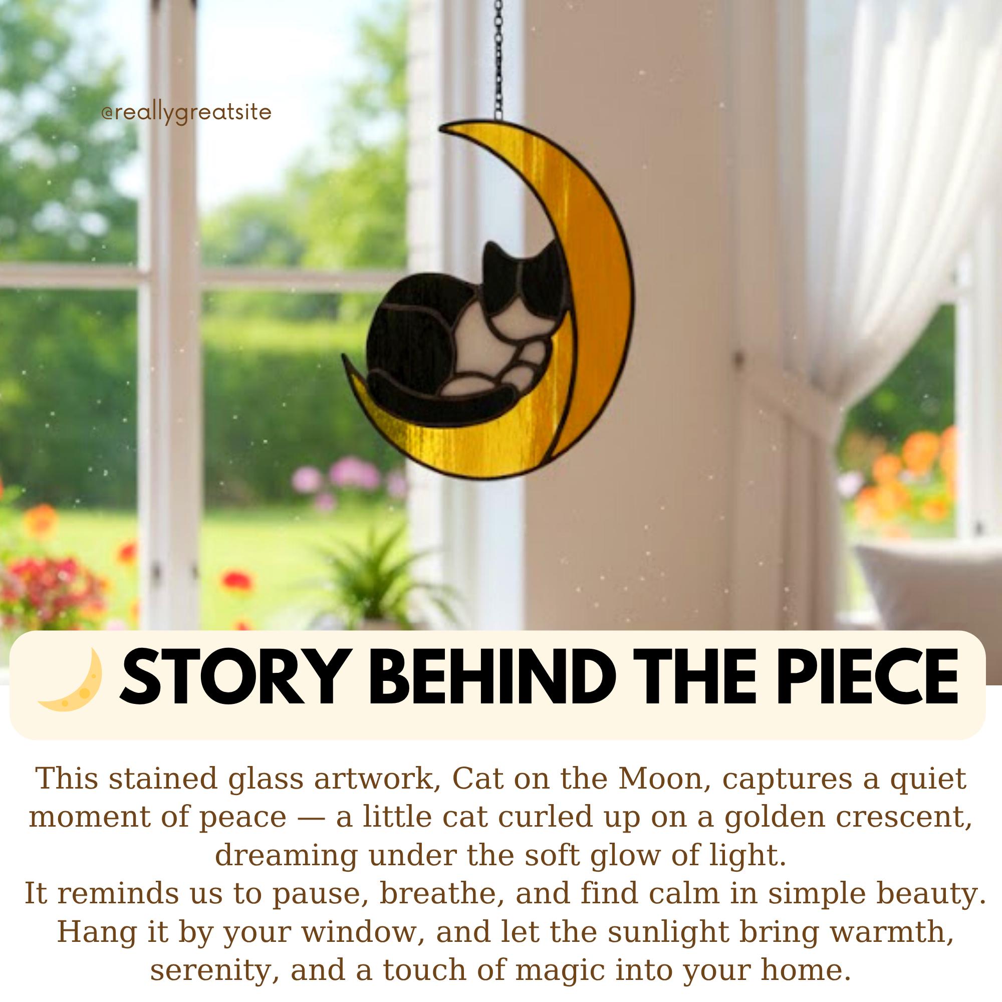 Close-up of stained glass cat moon ornament glowing in sunlight, glass art for window hanging