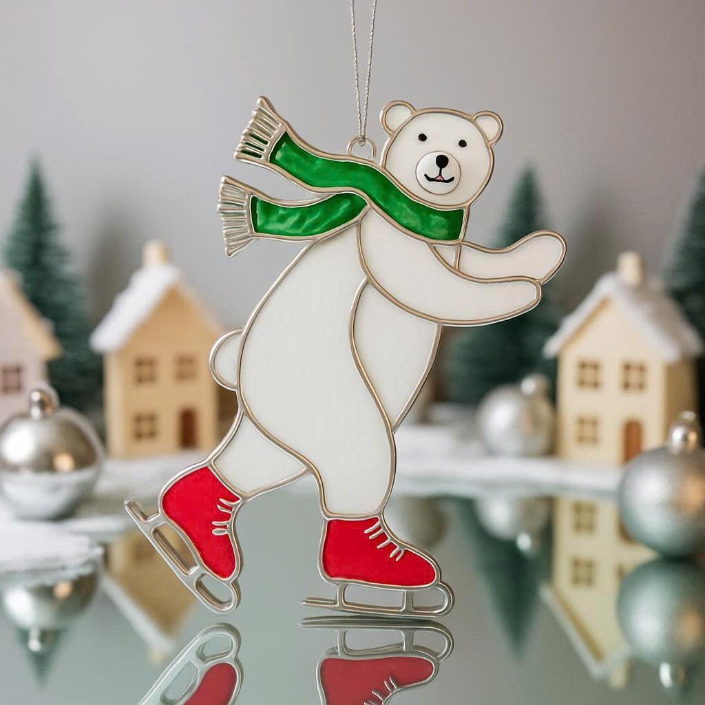 Handmade stained glass skating bear ornament placed on reflective winter background with houses and Christmas trees.