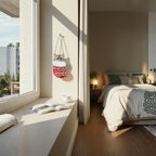 Woman smiling while decorating Christmas tree with stained glass cat ornament, festive moment.