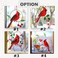 Cardinal stained glass ornament with cherries displayed in a bright, snow-filled scene.