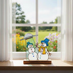 Funny glass snowman ornament on wooden base – unique Christmas home decor.