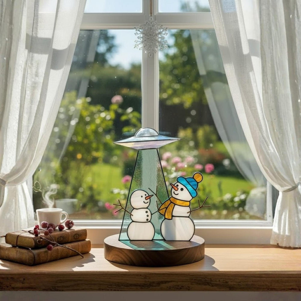 Handmade glass snowman decor surrounded by lights – Christmas home inspiration.