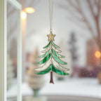 Christmas tree ornament (Style #1) hanging in a window overlooking a snow-covered suburban street.