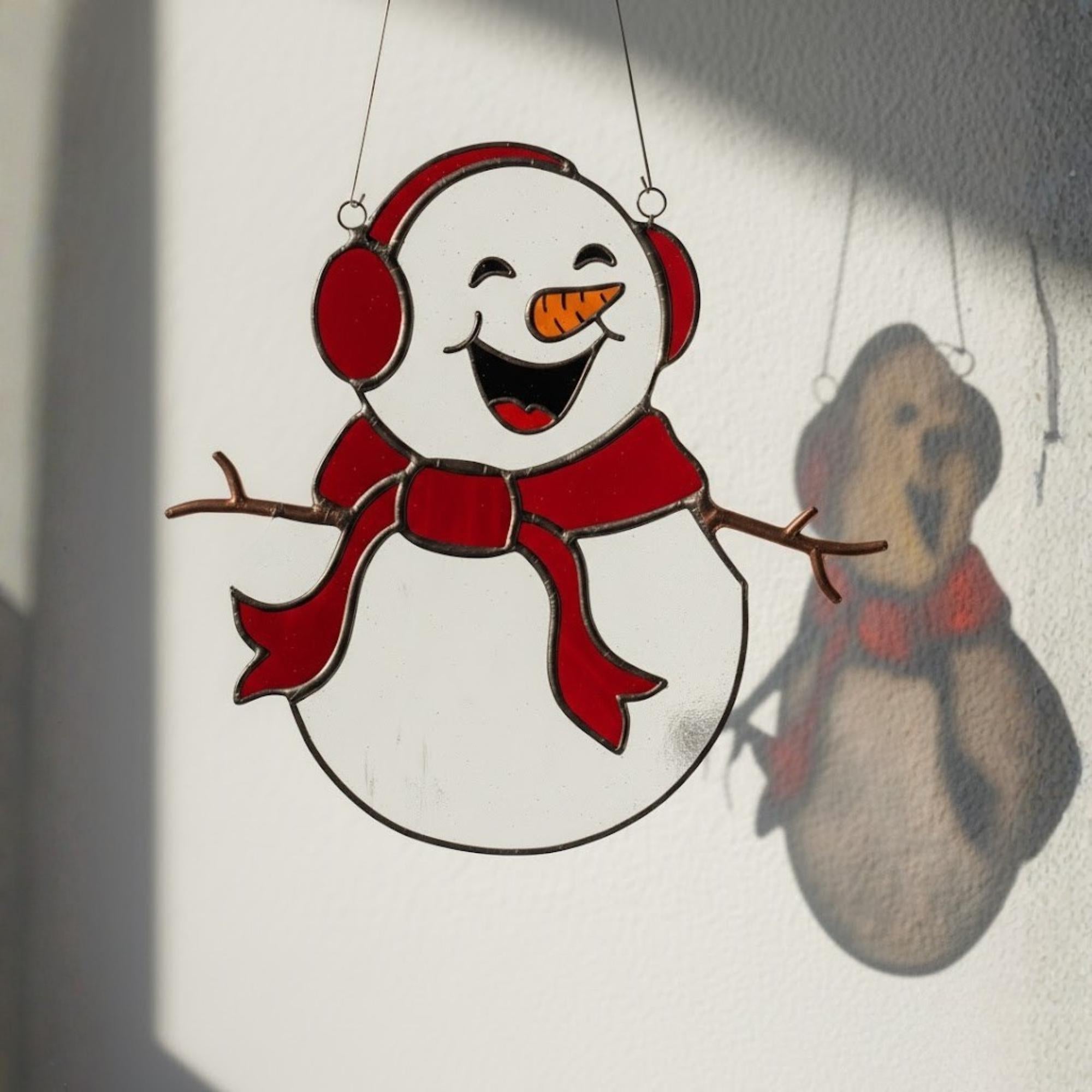Hanging stained glass snowman ornament – handmade home decor for the holidays.