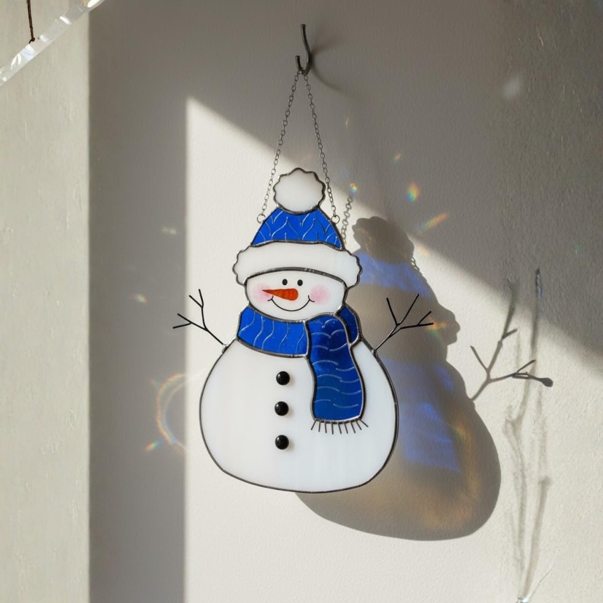 Cheerful red-hat snowman stained glass art piece – holiday home decoration idea.