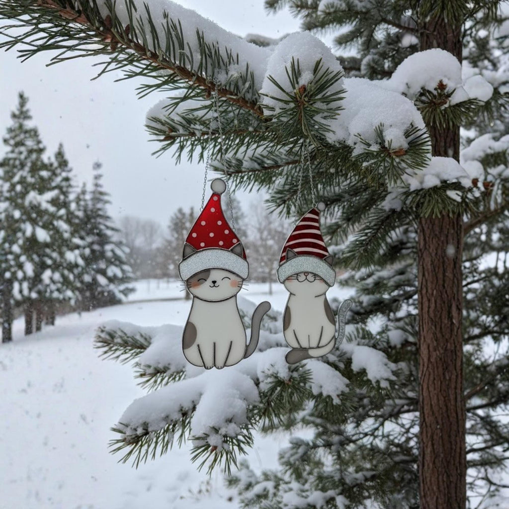 Flat lay of stained glass cat ornaments with Christmas lights – handmade holiday gift photo.