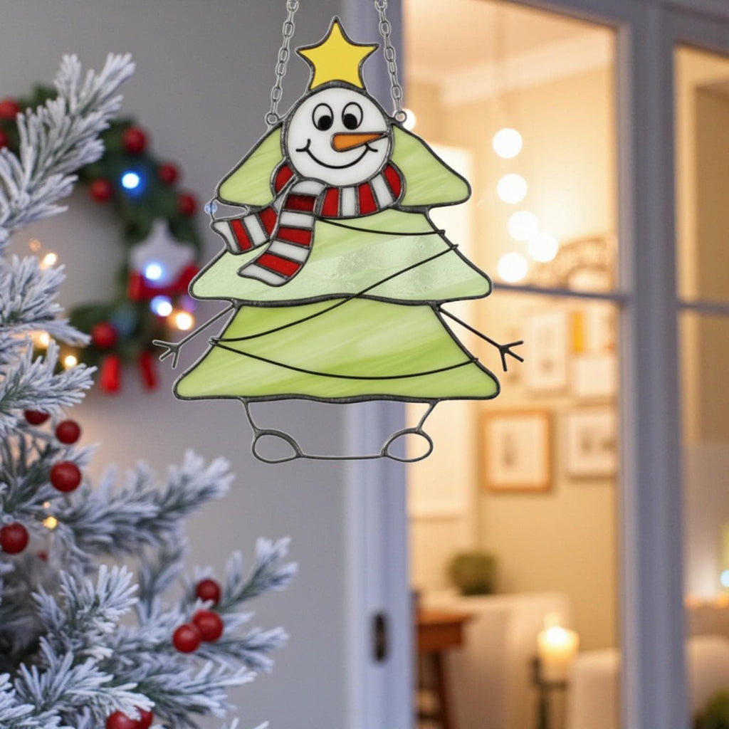 Handmade stained glass snowman and raccoon ornaments displayed together.