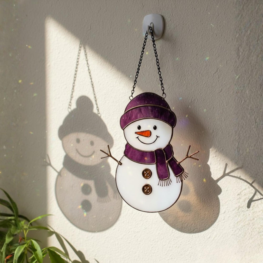 Blue hat stained glass snowman smiling near window – handmade holiday gift idea.