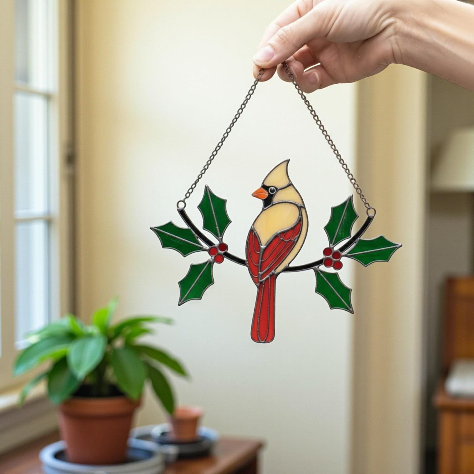 Red bird stained glass ornament close-up – memorial gift or Christmas decor for her and mom.