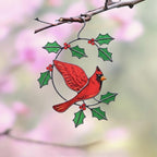 Handmade red cardinal bird suncatcher catching sunlight through glass – vibrant home decor accent.