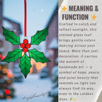 Holly leaf stained glass ornament hanging by window – Christmas home decor glowing in sunlight.