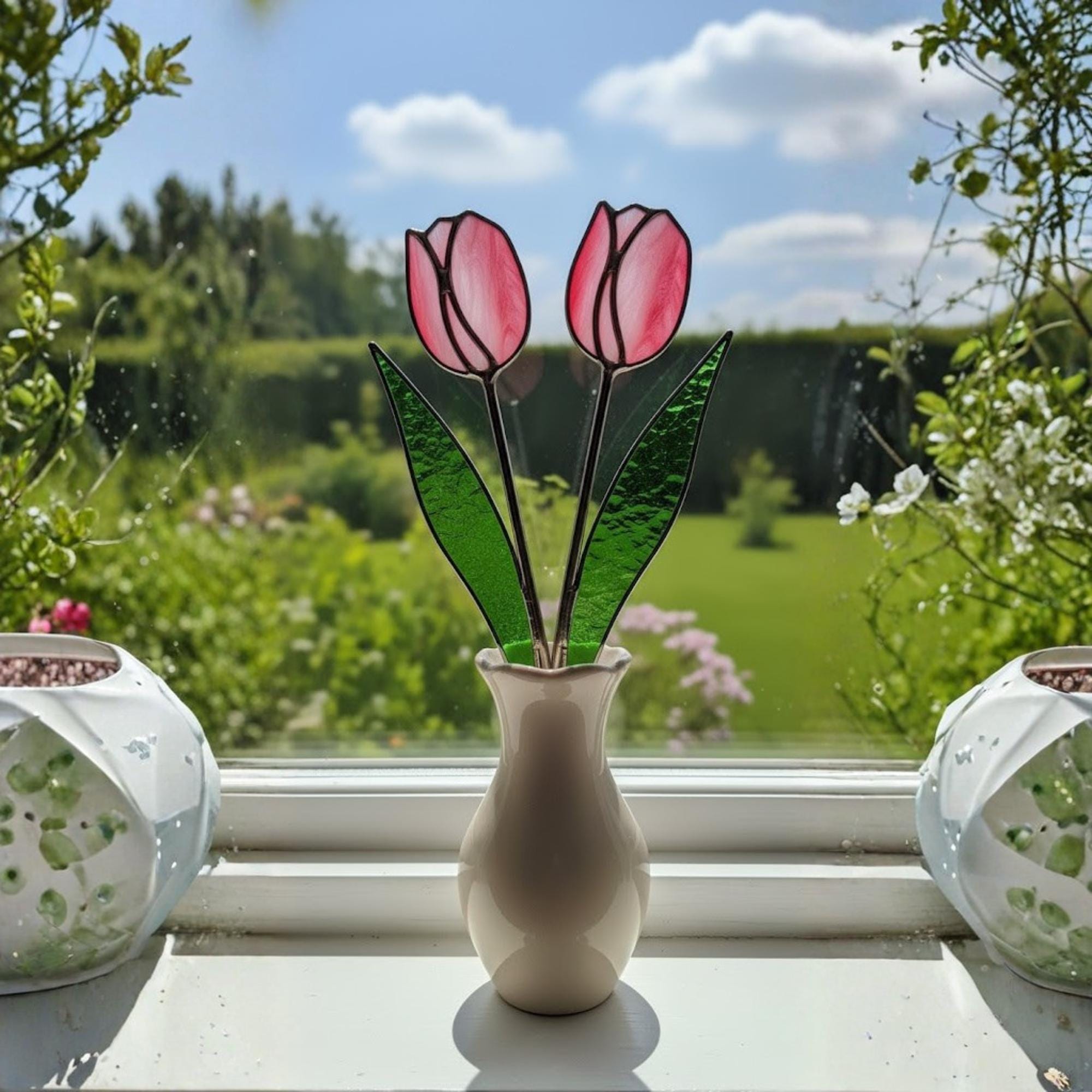 Two stained glass tulips in a vase glowing with morning light – simple elegant handmade decor.