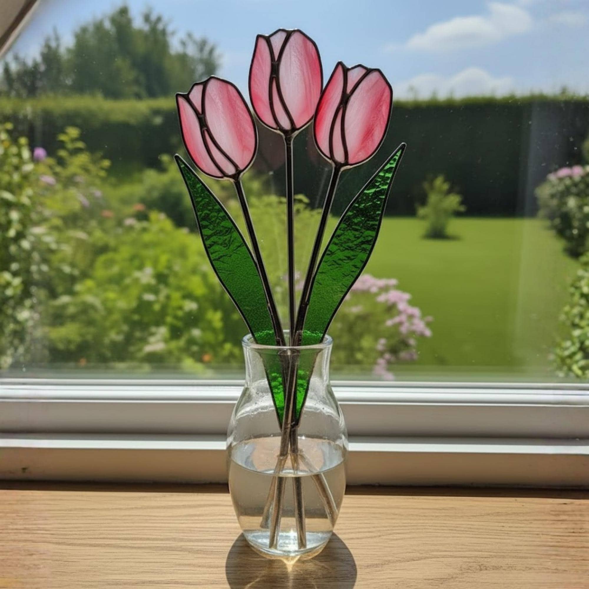 Three pink glass tulips in a vase – minimalist stained glass flower arrangement for living room.