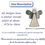 Memorial angel ornament in window, symbol of comfort and light for loved ones.