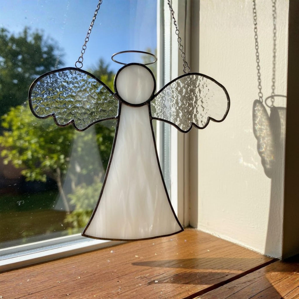 Beautiful handmade angel suncatcher for window decoration and Christmas home decor.