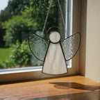 Elegant white glass angel ornament for memorial remembrance and spiritual comfort.