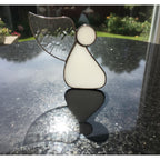 Guardian angel ornament hanging in bright home interior symbolizing peace and love.