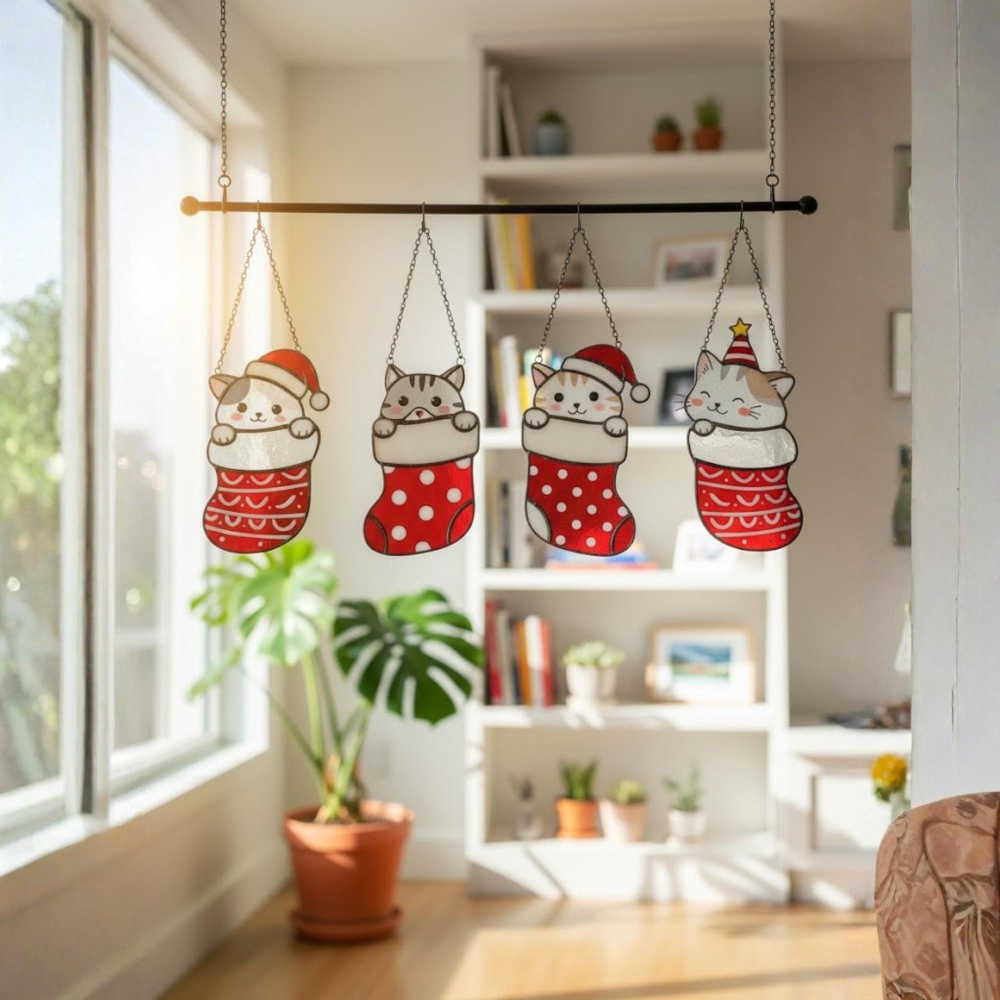Christmas cat stained glass ornament hanging on wall near window, handmade red and white decor.