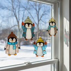 Set of penguin stained glass ornaments with blue and yellow hats, winter themed suncatcher decor.