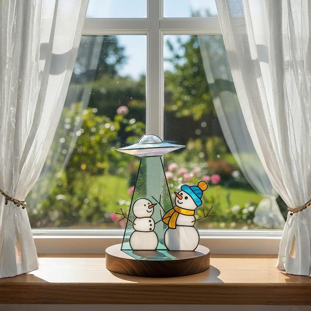 Handmade stained glass snowman ornament with UFO design – winter holiday table decor.