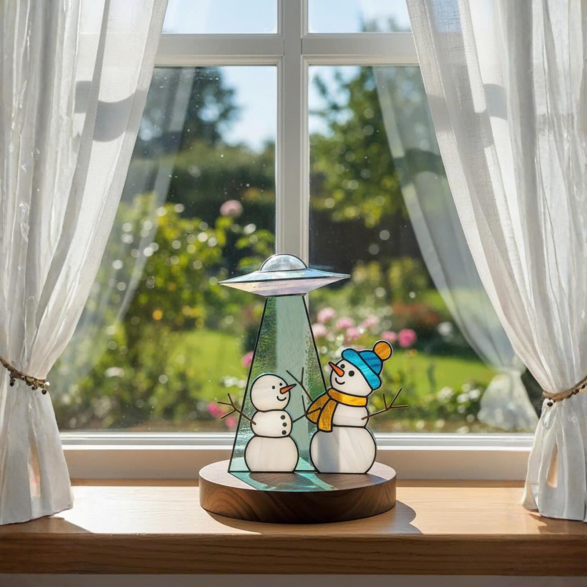 Handmade stained glass snowman ornament with UFO design – winter holiday table decor.