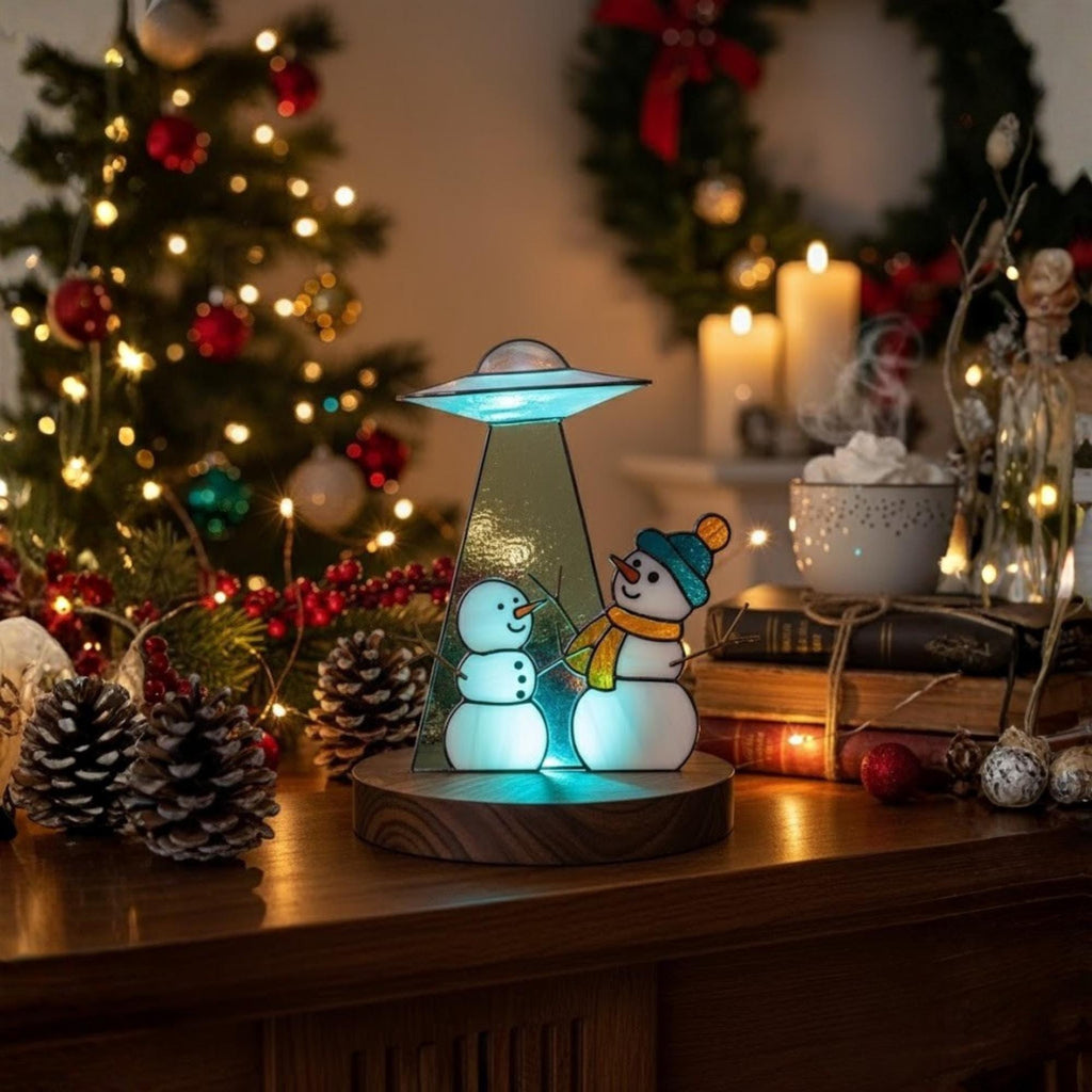 Stained glass snowman suncatcher on windowsill – handmade holiday gift for her or mom.