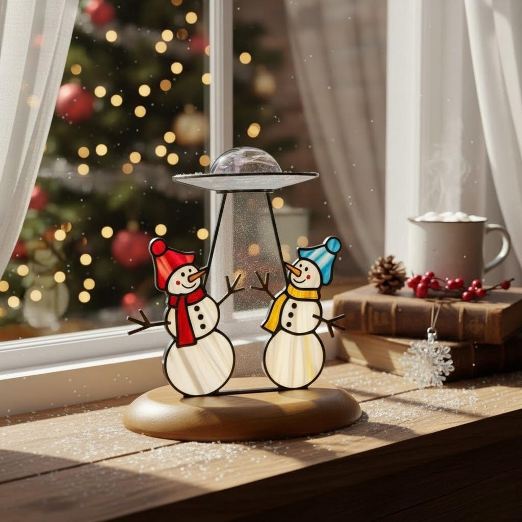 Funny UFO snowman ornament glowing in daylight – perfect handmade Christmas decoration.