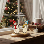 Funny UFO snowman ornament glowing in daylight – perfect handmade Christmas decoration.