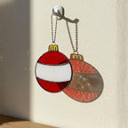 Red and white bauble stained glass ornament close up, Christmas tree décor