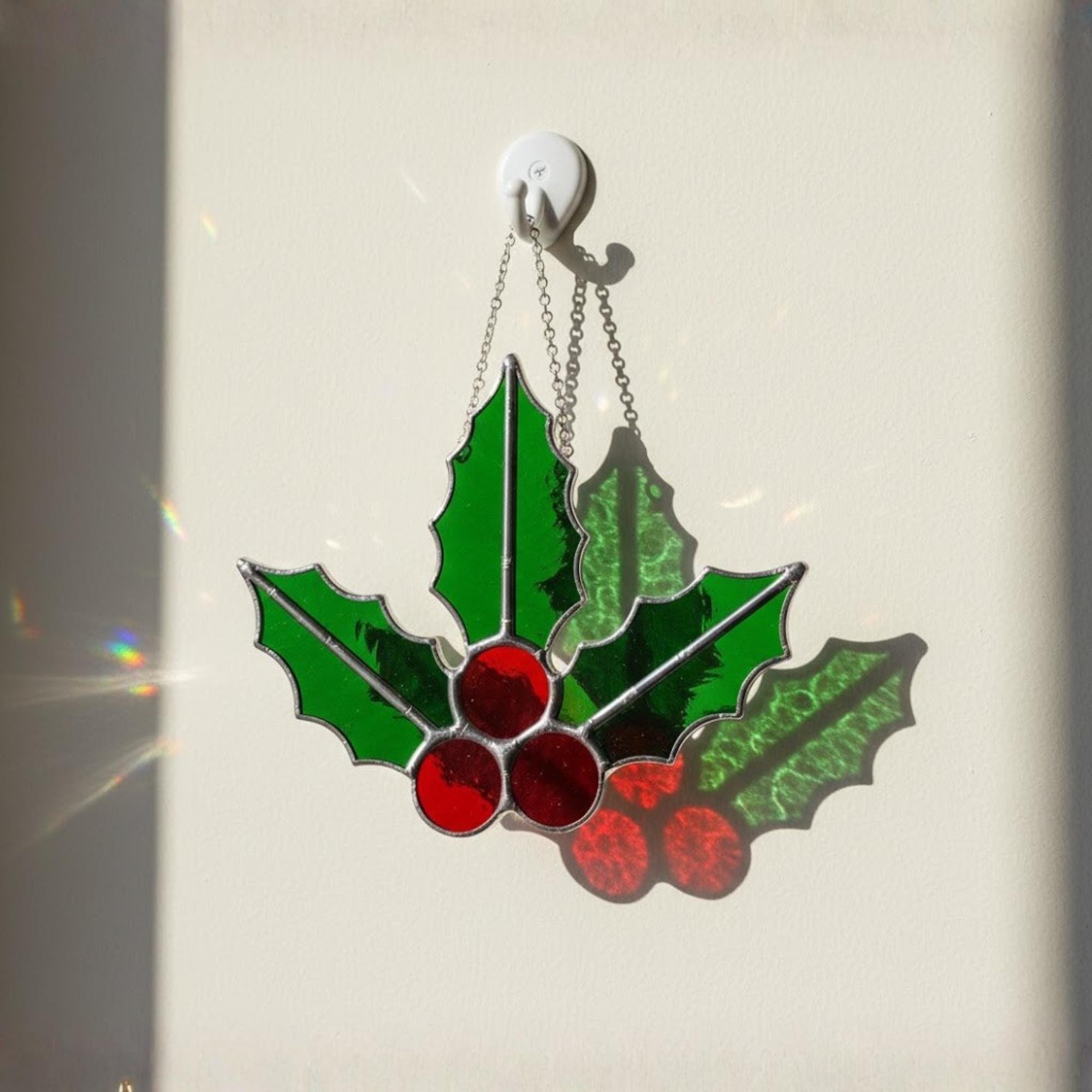 Large holly leaves and berries stained glass, festive winter decoration