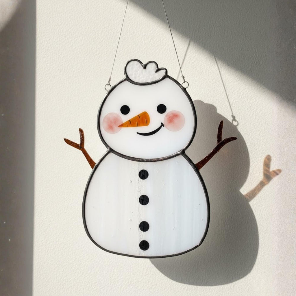 Handmade snowman glass ornament close-up – winter home decoration art.