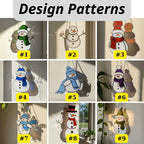 Woman hanging snowman stained glass suncatcher by window – winter home decoration.