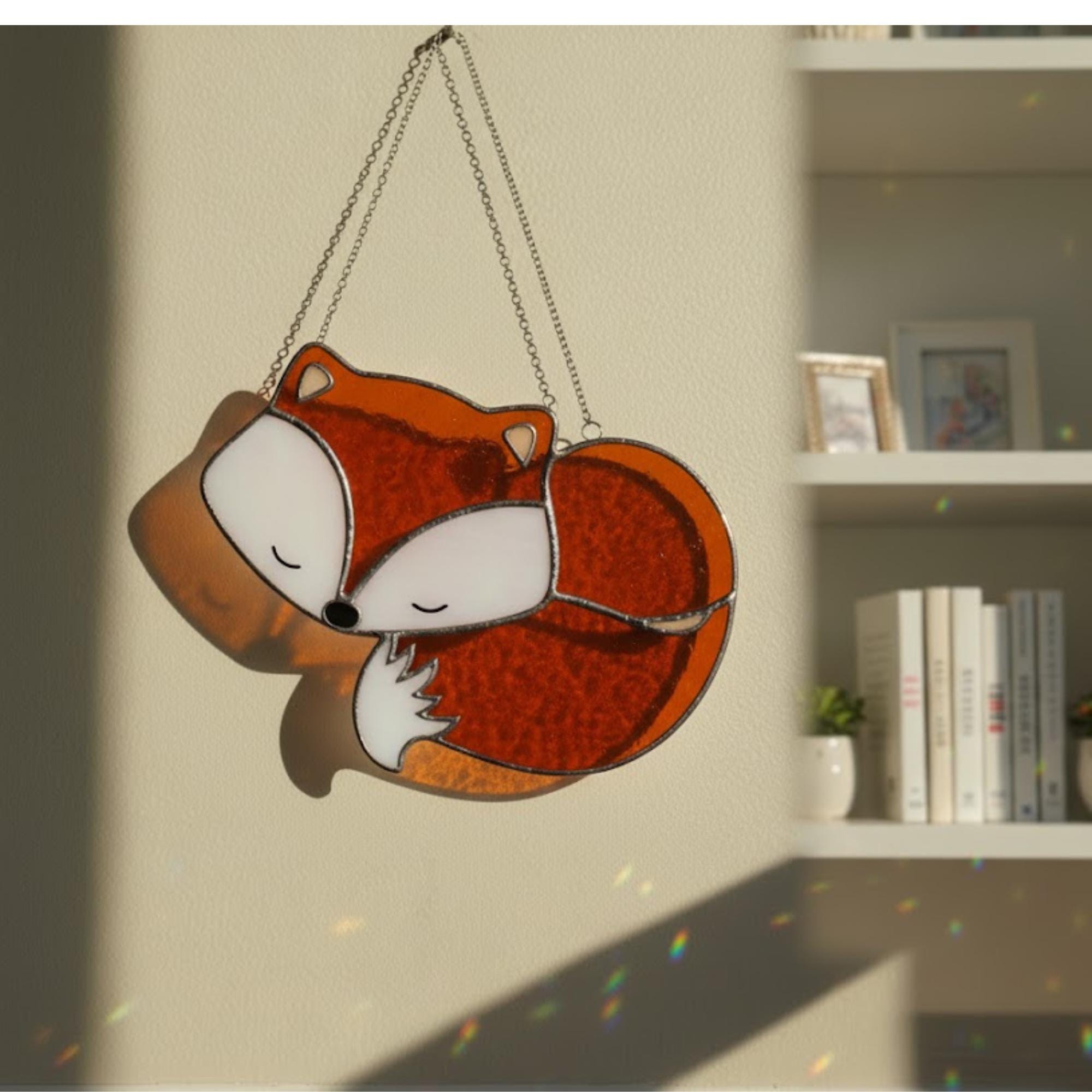 Stained glass fox curled design with warm amber colors, handmade suncatcher