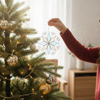 Blue stained glass snowflake ornament hanging on Christmas tree, festive decor