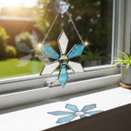 Snowflake suncatcher displayed on bedroom window, handmade winter ornament
