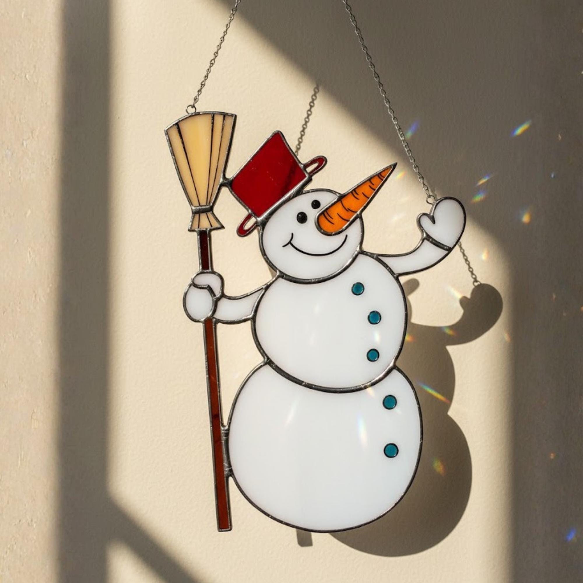 Cute stained glass snowman with orange scarf – handmade winter ornament decoration.