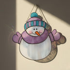 Pink coat snowwoman stained glass ornament – warm handmade gift for winter holidays.