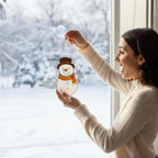 Woman smiling holding stained glass snowman suncatcher – Christmas gift for her handmade decor.