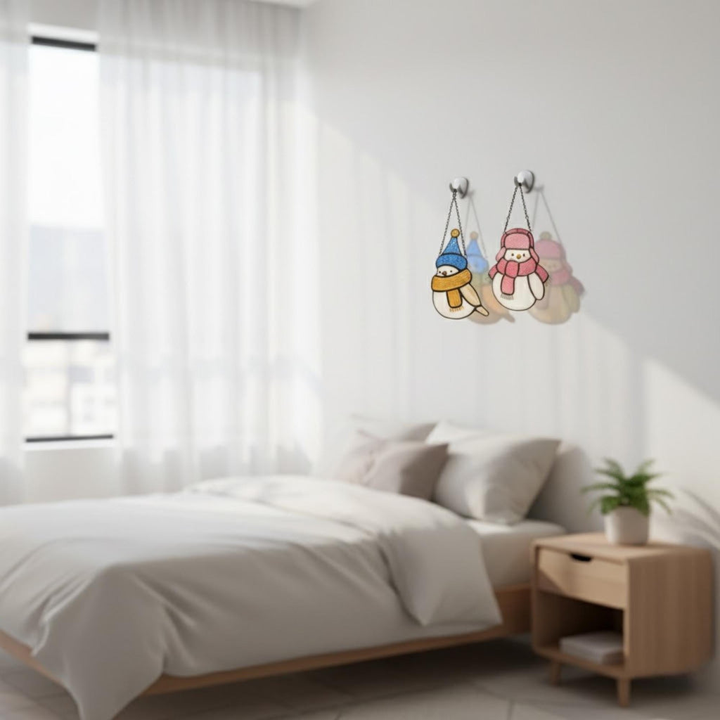 Bright stained glass bird ornaments displayed in bedroom – warm handmade suncatcher decor.