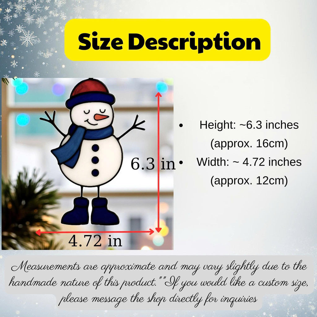 A hand holding a stained glass snowman suncatcher  outdoors against a blurred house background.